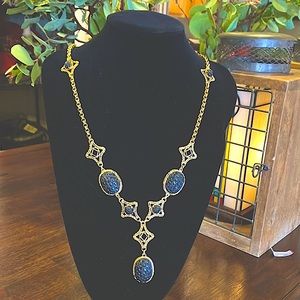 Victorian style statement black and gold colored necklace.